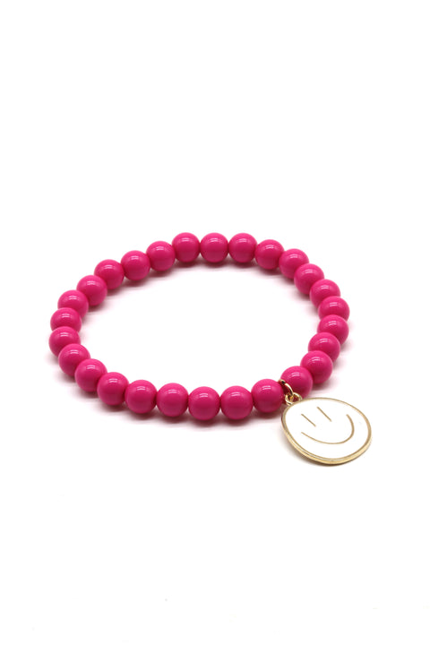 Pinkes Perlenarmband mit großem weißen Smiley Anhänger